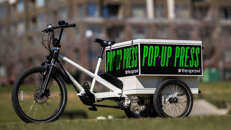 The Sprawl rolls an analog printing press onto the streets of Calgary